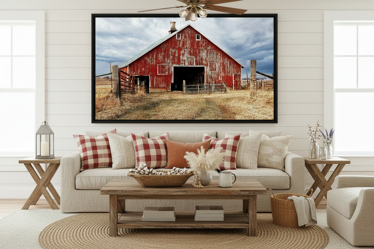 Living room with a large framed picture of a red barn on the wall.