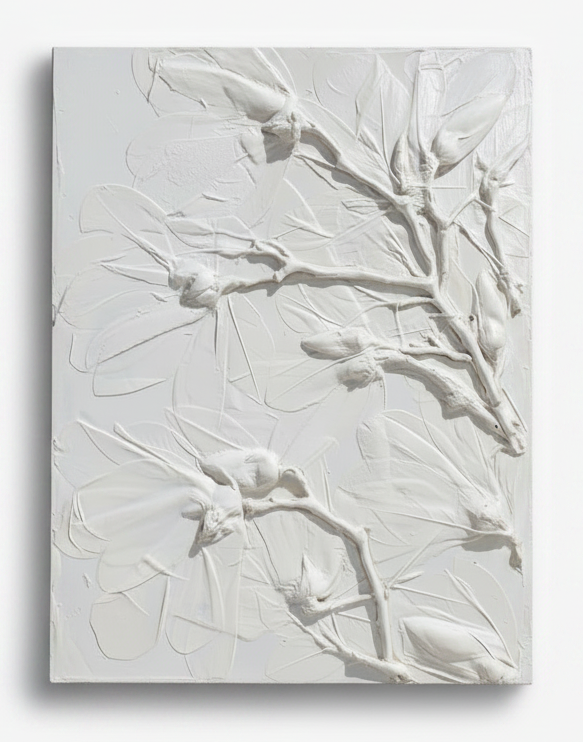 white plaster bas relief of magnolia in a satin finish