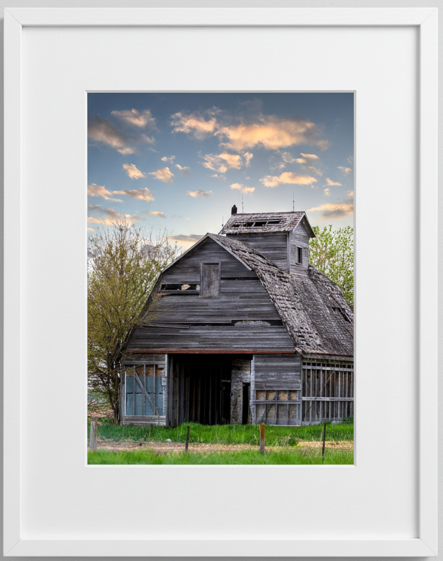 Framed photograph of an old wooden barn in iowa with a white frame.