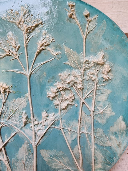 This is a closeup view of the bas relief on the right-hand side of the botanical plaster cast.