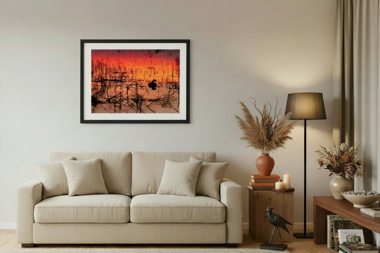 Living room with beige sofa, framed artwork, and decorative items.