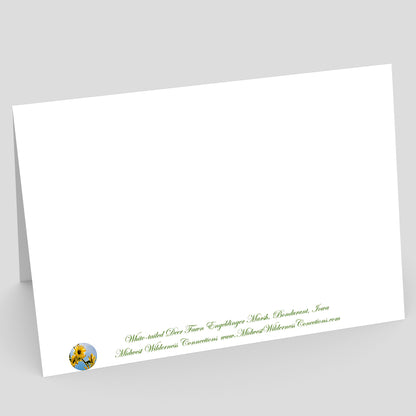 view of the backside of a White greeting card with green text and a logo on a gray background. The text along the bottom side of the card describes the image on the front of the card and where the photo was taken.