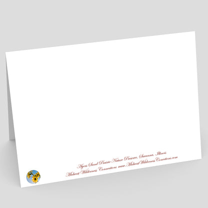 Backside view of a white card with red text and a logo on a gray background. The text at the bottom of the back explains what the scene of the card is of and where the photo was taken.