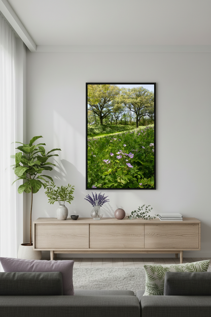 Framed nature print on a wall above a wooden console table in a living room.