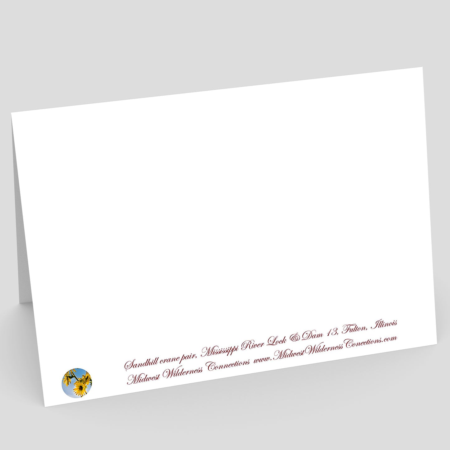 White card with red text and a logo on a gray background. The text along the bottom edge describes the image on the front of the card, and where the photo was taken