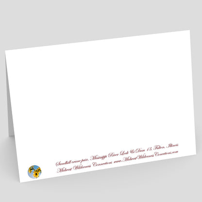White card with red text and a logo on a gray background. The text along the bottom edge describes the image on the front of the card, and where the photo was taken