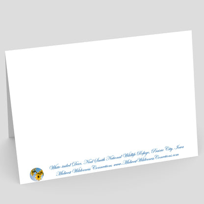 view of the back side of a White card with blue text and a logo on a gray background. the text along the bottom edge describes the photo on the front of the card and where the photo was taken