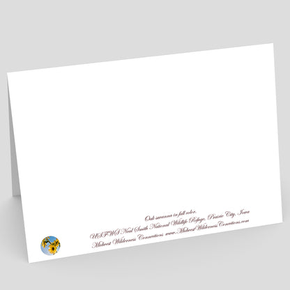 Back side view of a White card with printed text on a gray background. The text along the bottom edge describes the photo on the front of the card and where it was taken
