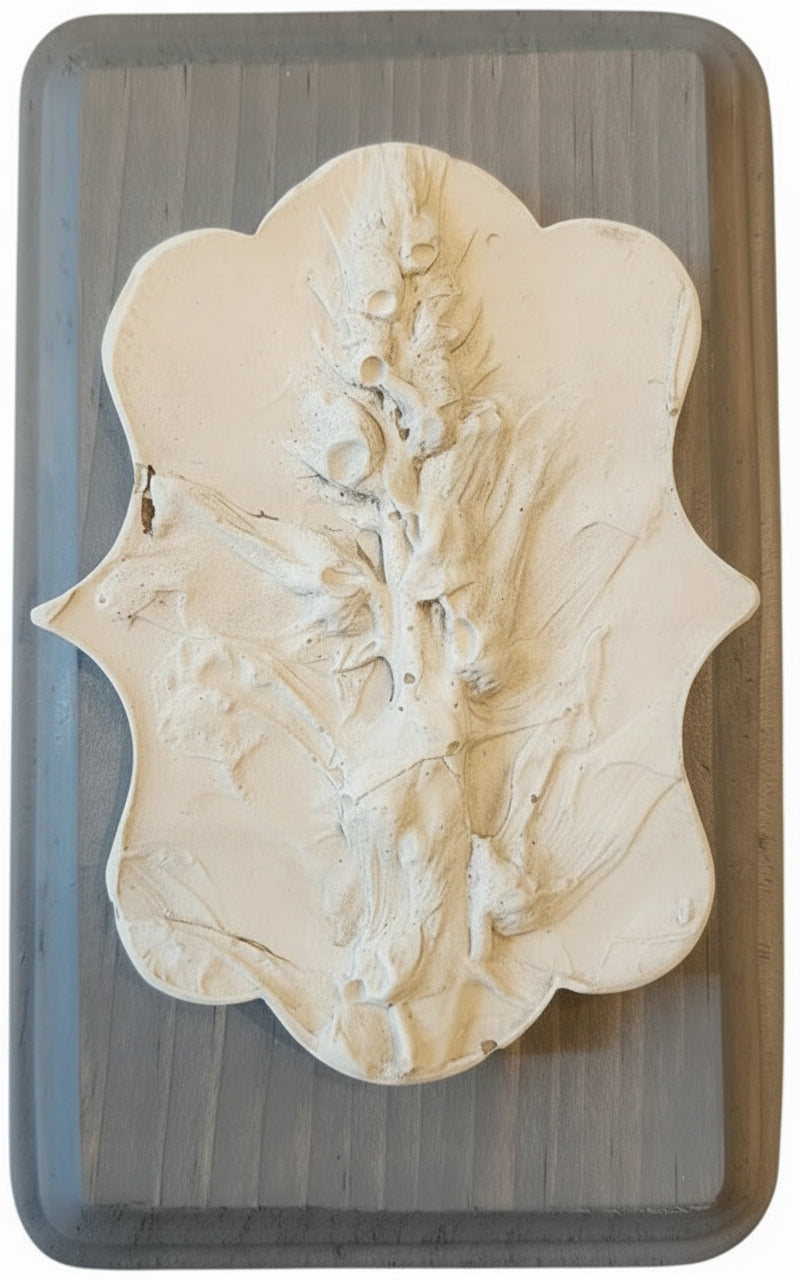 Victorian shaped plaster cast of Snapdragon on a decorative wood plaque in blue-gray finish 