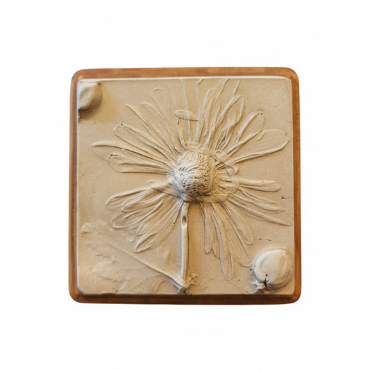 Square plaster cast of flowers mounted on an oak stained wood plaque