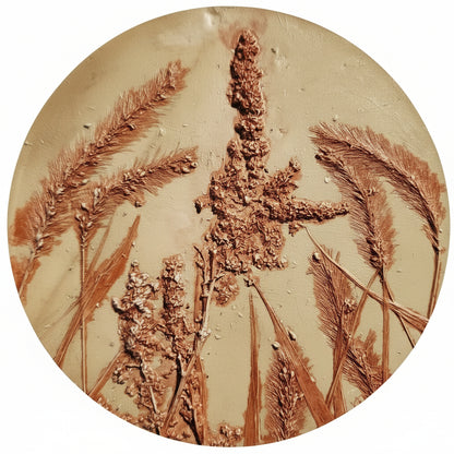 Round plaster Artwork featuring foxtail and amarathus seedheads 